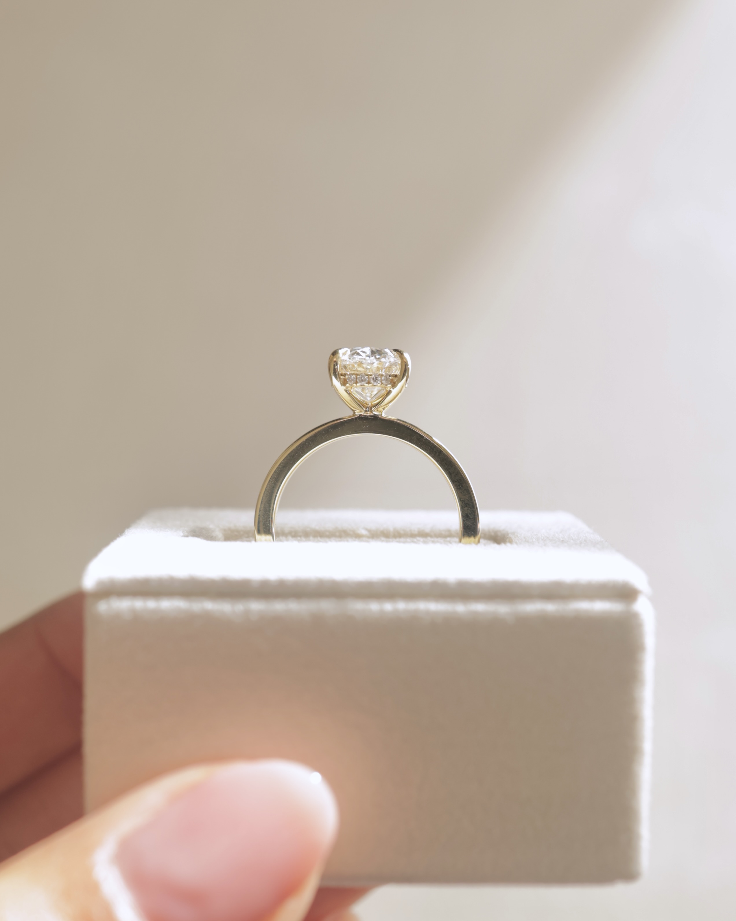 Nikita - Oval Flat Cigar Band Solitaire with Hidden Halo Lifestyle Image