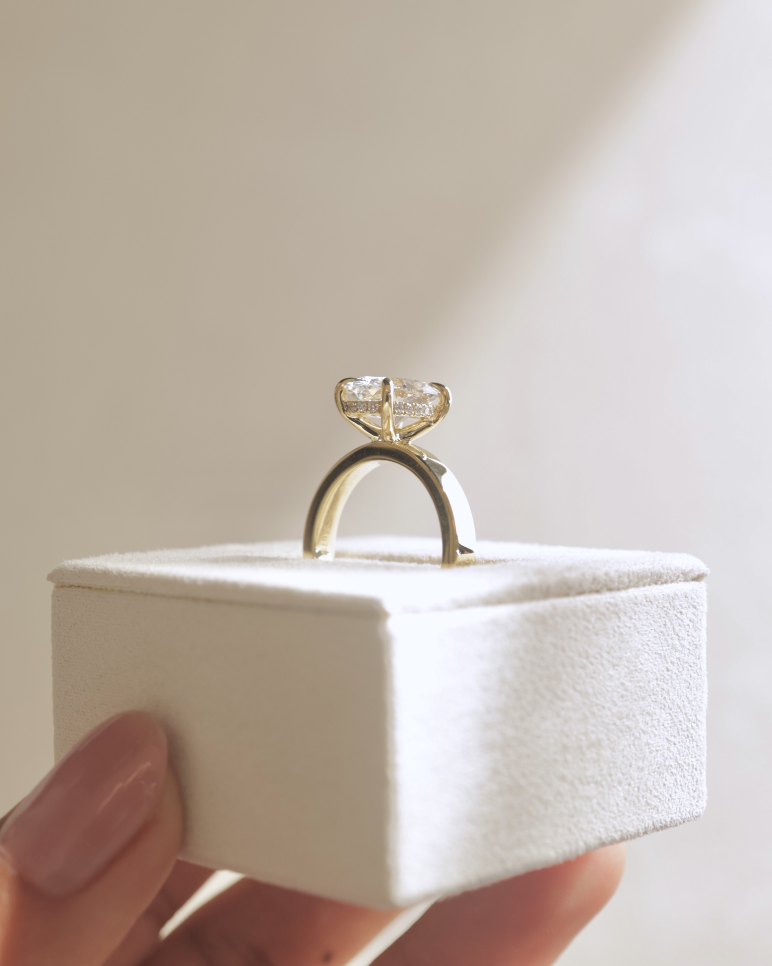 Nikita - Oval Flat Cigar Band Solitaire with Hidden Halo Lifestyle Image