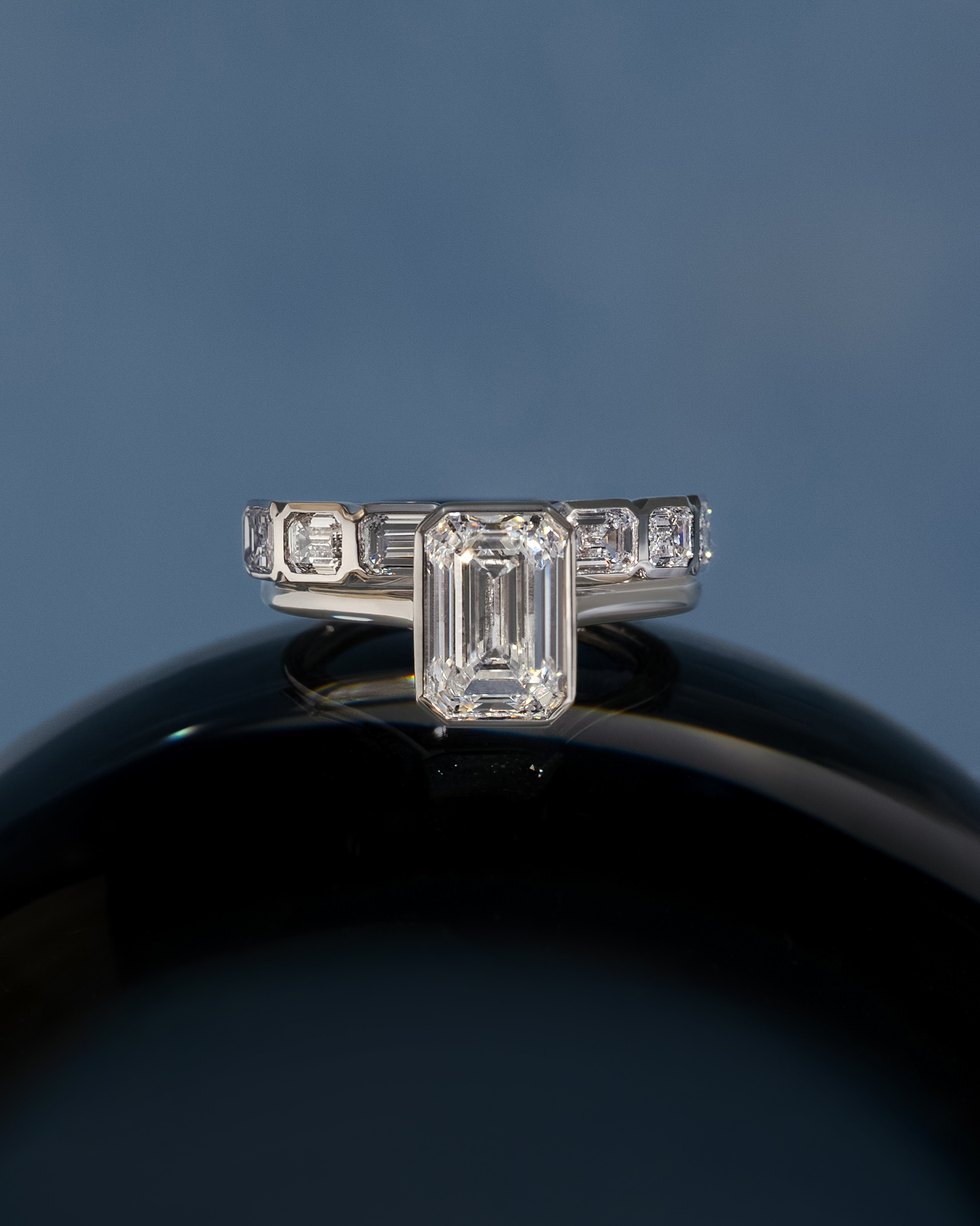 Nikki - Bezel Set Emerald Wedding Ring Lifestyle Image