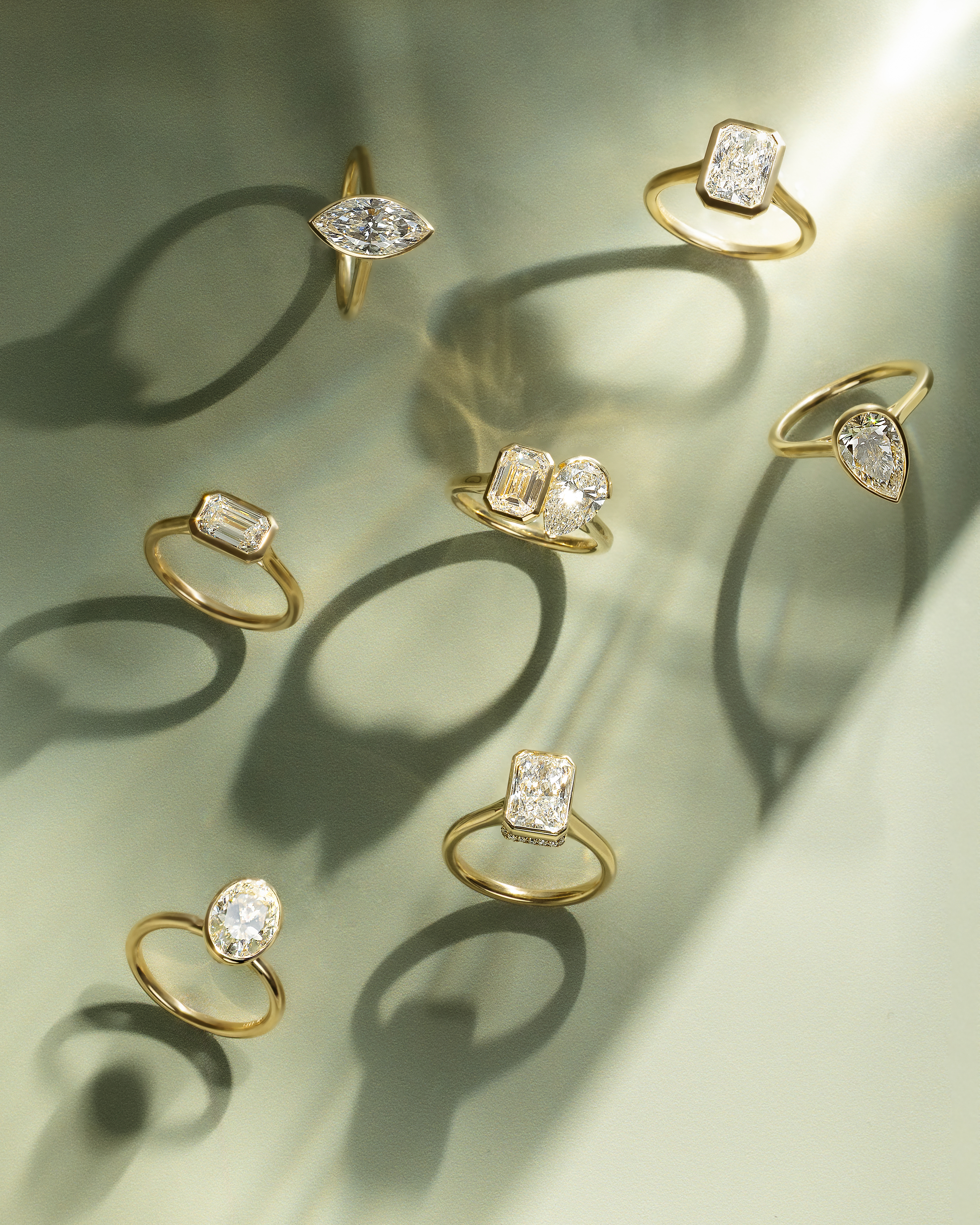 Olive - East West Emerald Solitaire with Cathedral Bezel Setting Lifestyle Image