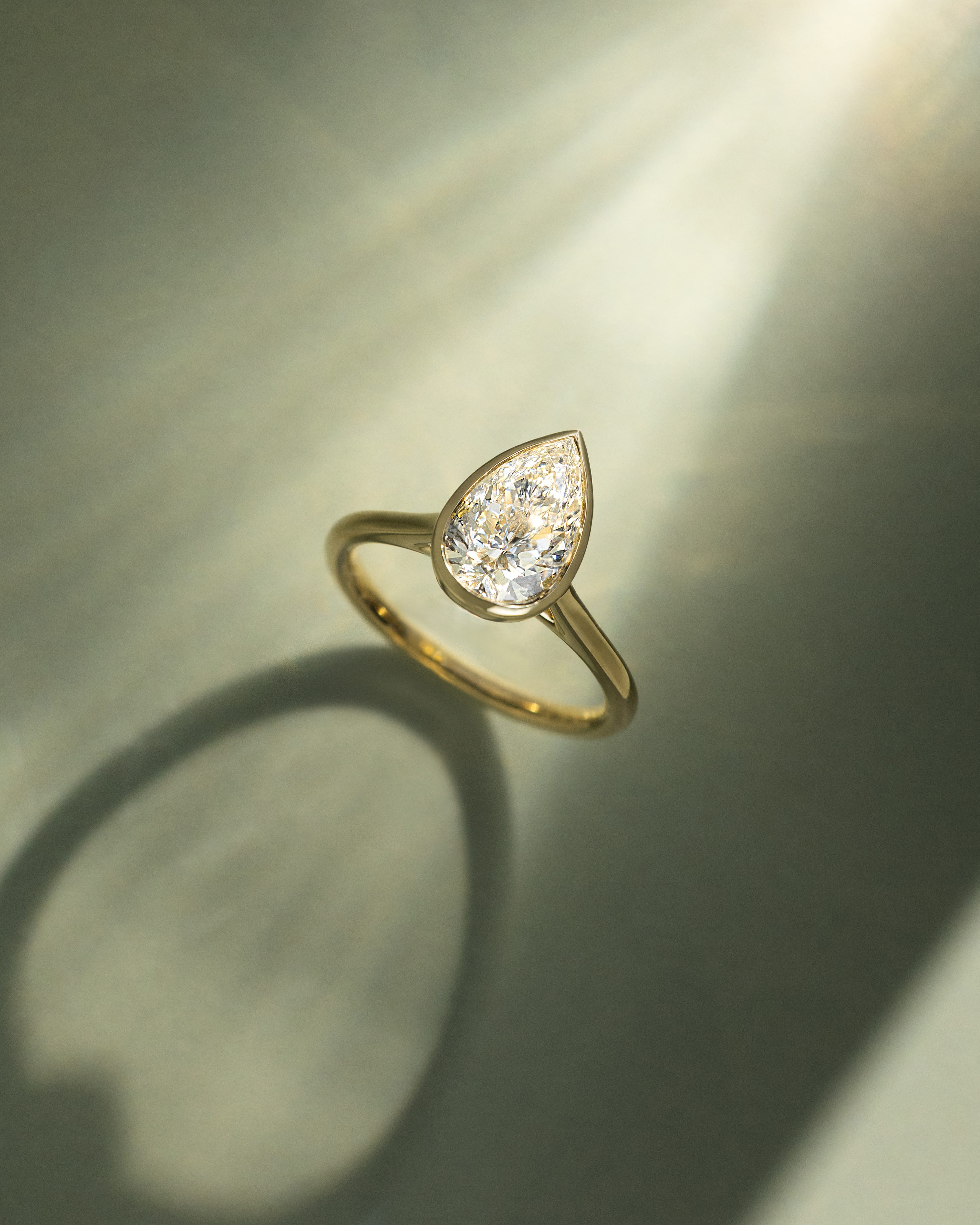 Paris - Pear Solitaire with Cathedral Bezel Setting Lifestyle Image