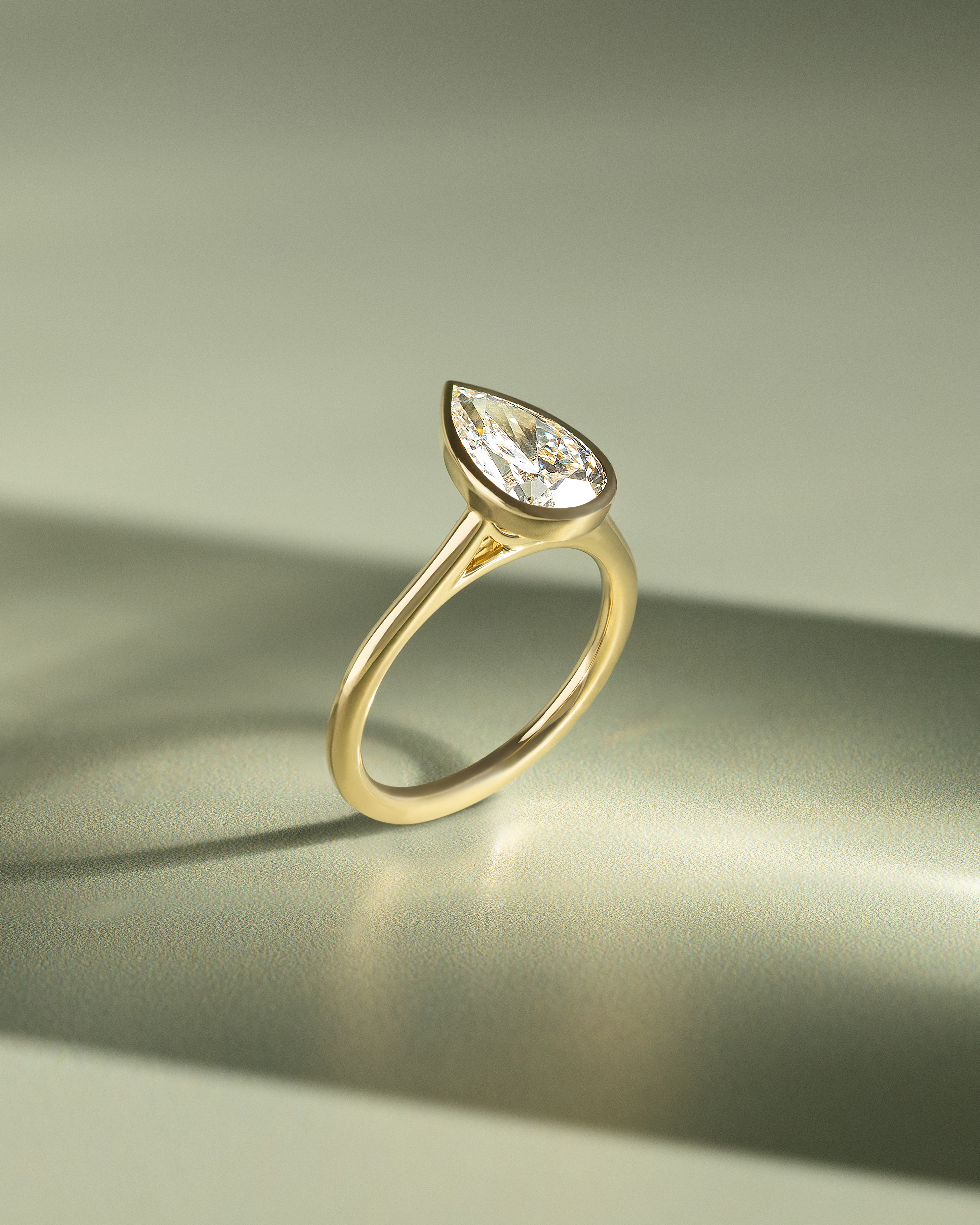 Paris - Pear Solitaire with Cathedral Bezel Setting Lifestyle Image