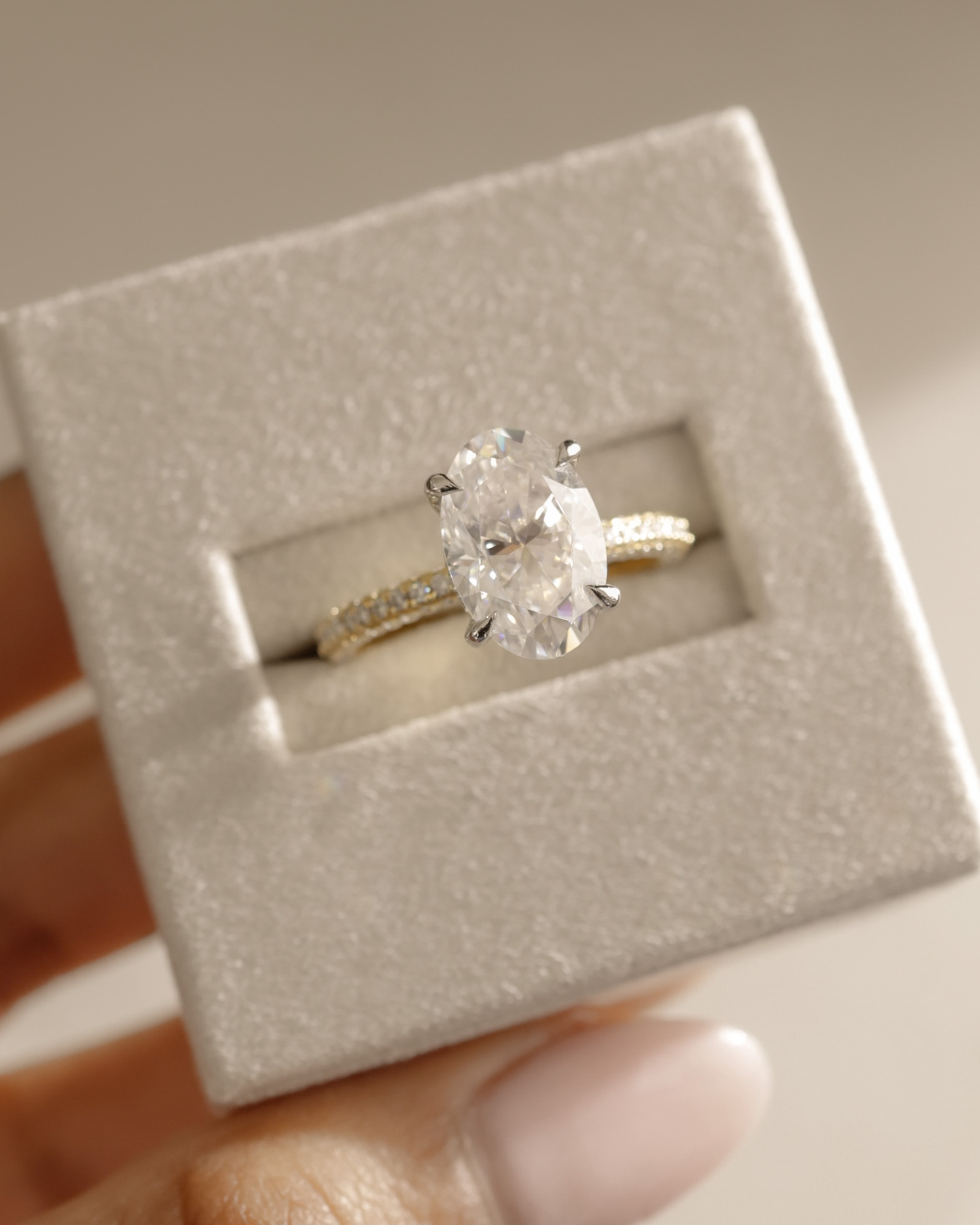 Penelope   Oval Solitaire with Hidden Halo and Triple Pav Lifestyle Image