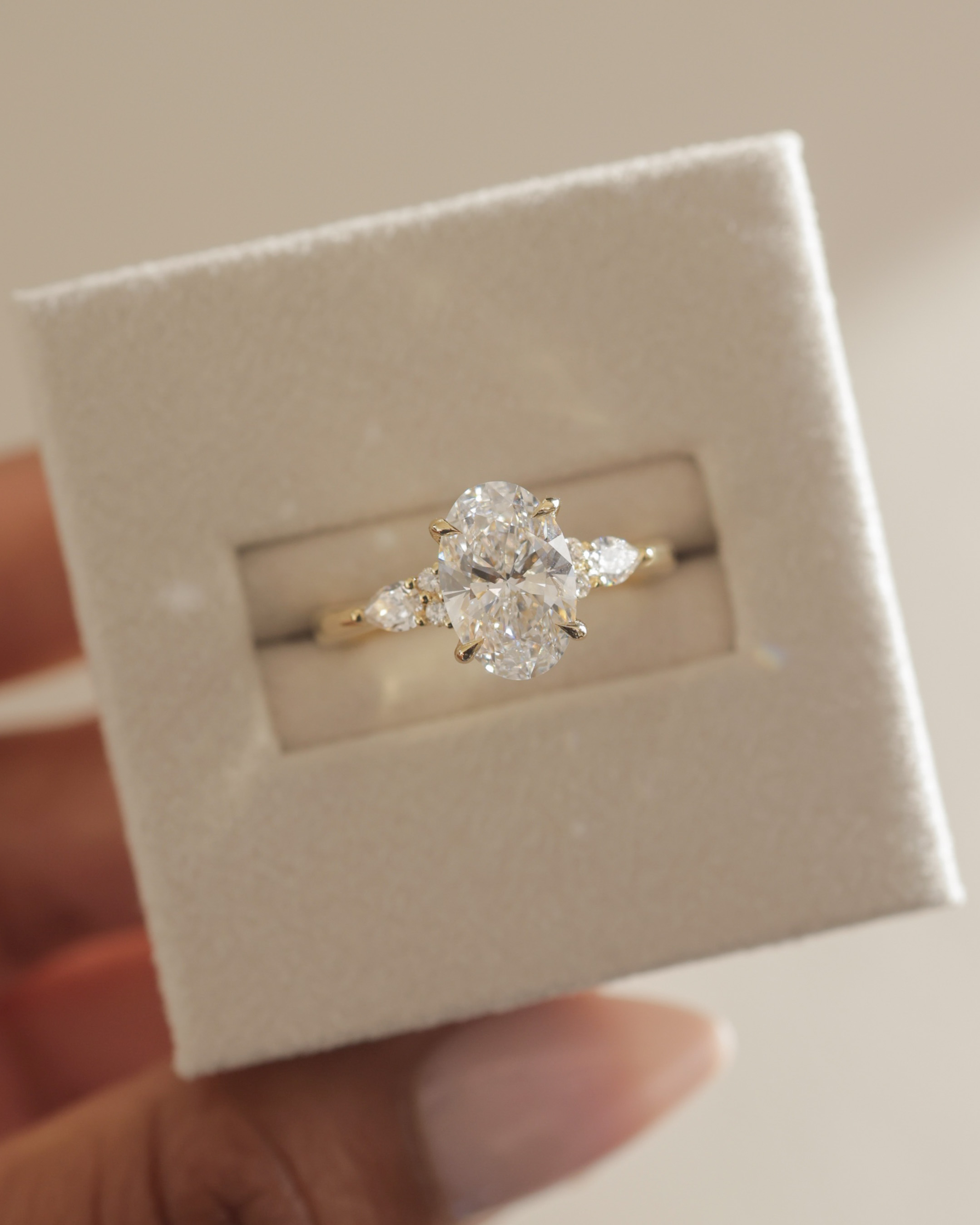 Sheridan  Oval Trilogy with Round and Pear Stones Lifestyle Image