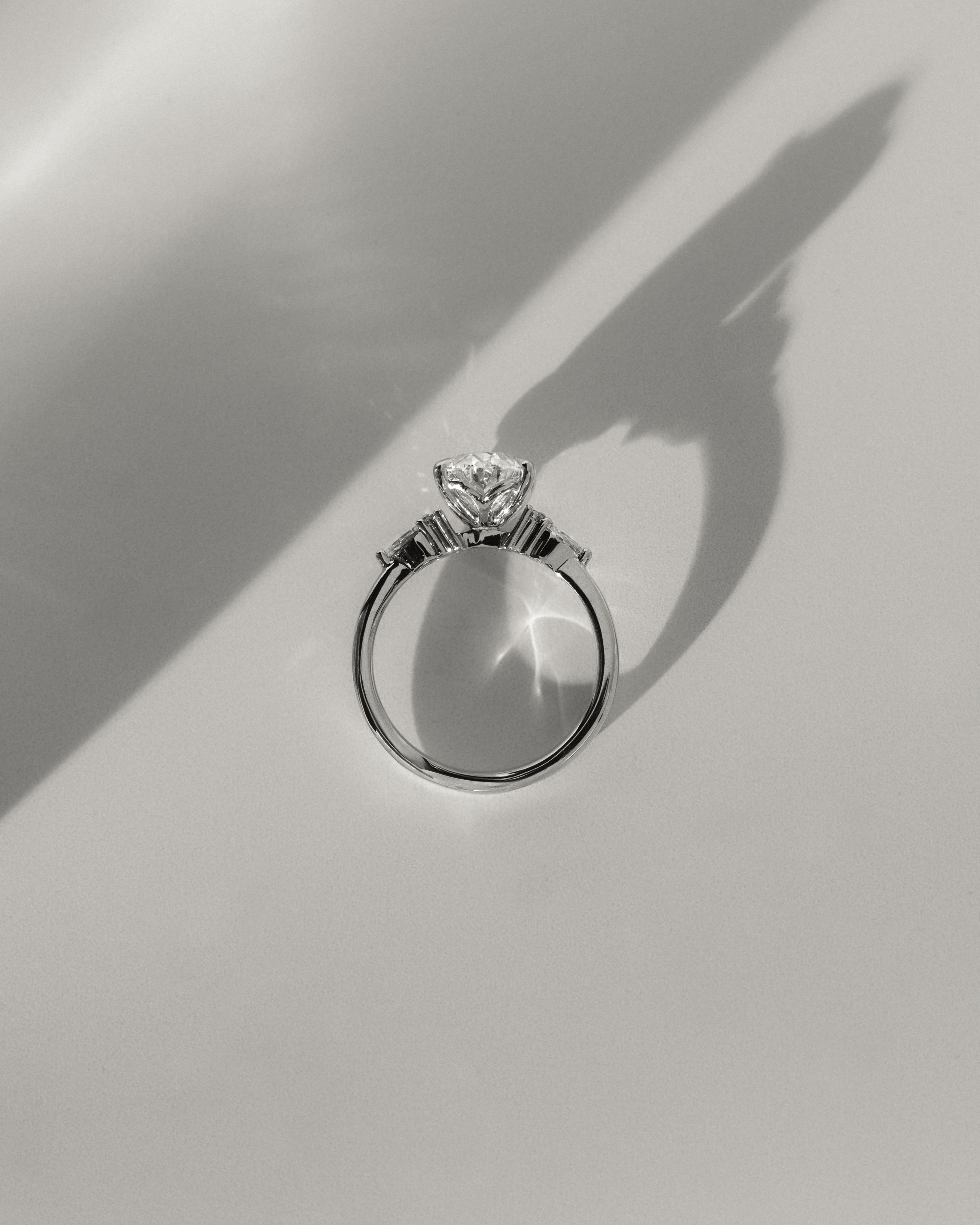 Sheridan  Oval Trilogy with Round and Pear Stones Lifestyle Image