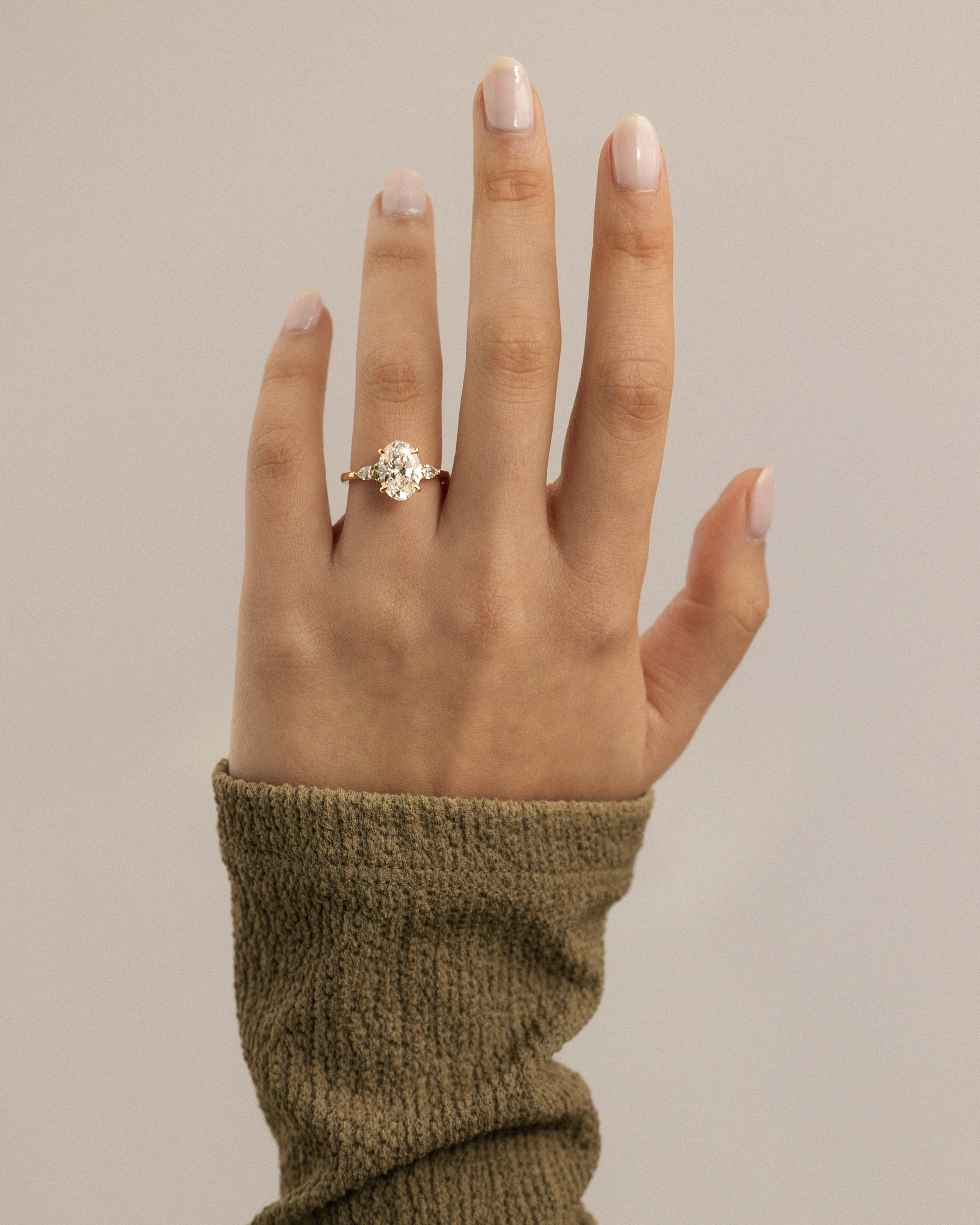 Sheridan  Oval Trilogy with Round and Pear Stones Lifestyle Image