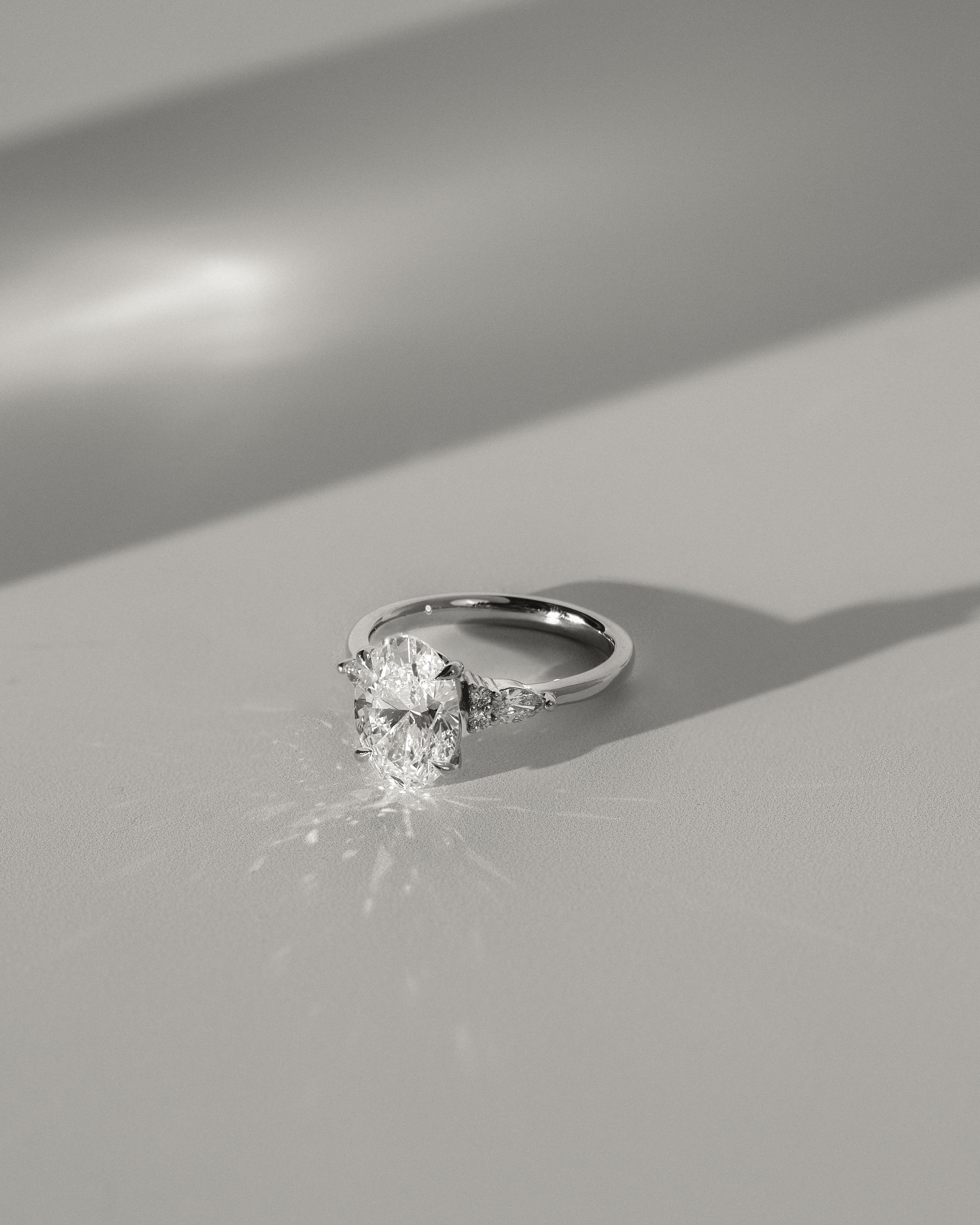 Sheridan  Oval Trilogy with Round and Pear Stones Lifestyle Image