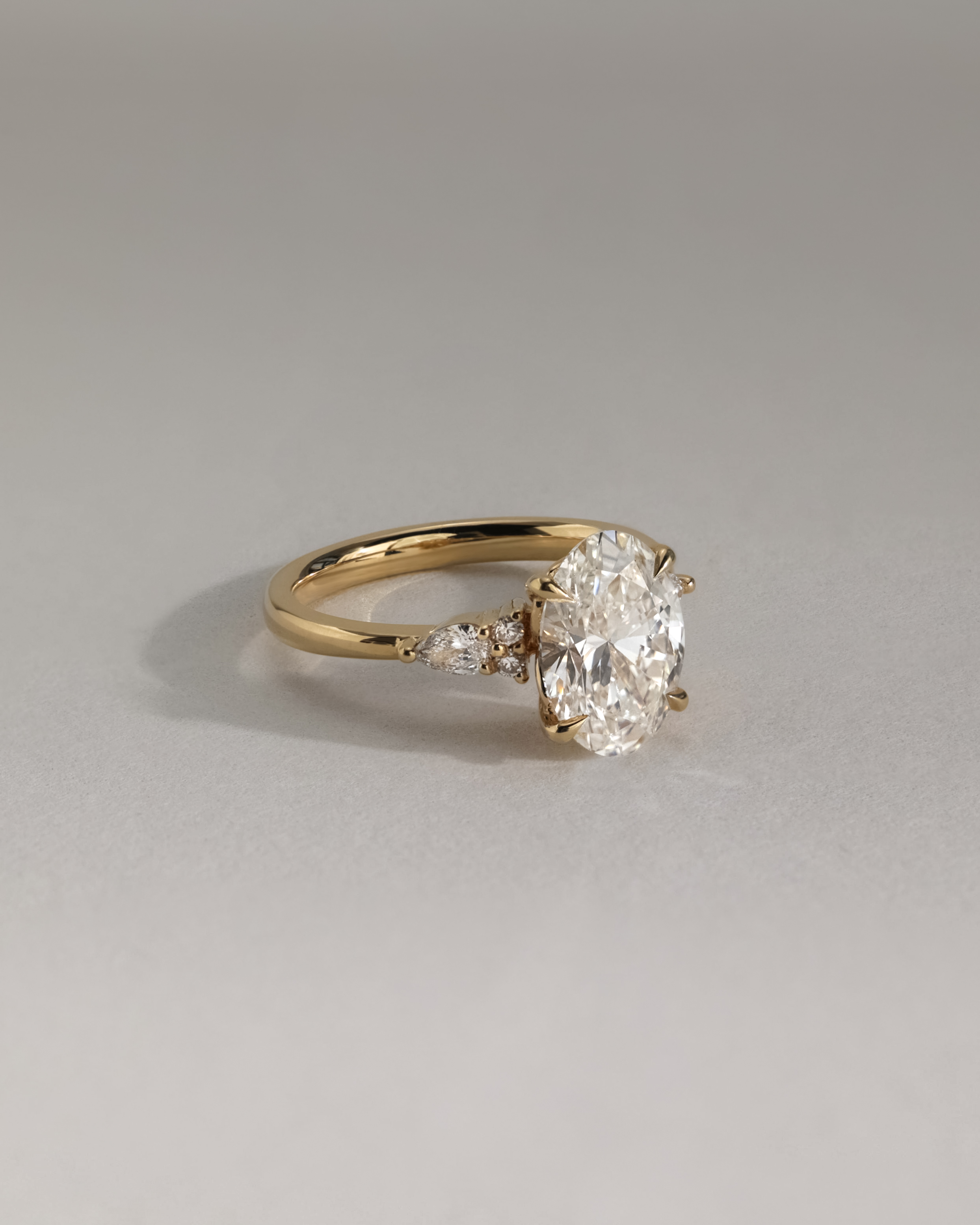 Sheridan  Oval Trilogy with Round and Pear Stones Lifestyle Image