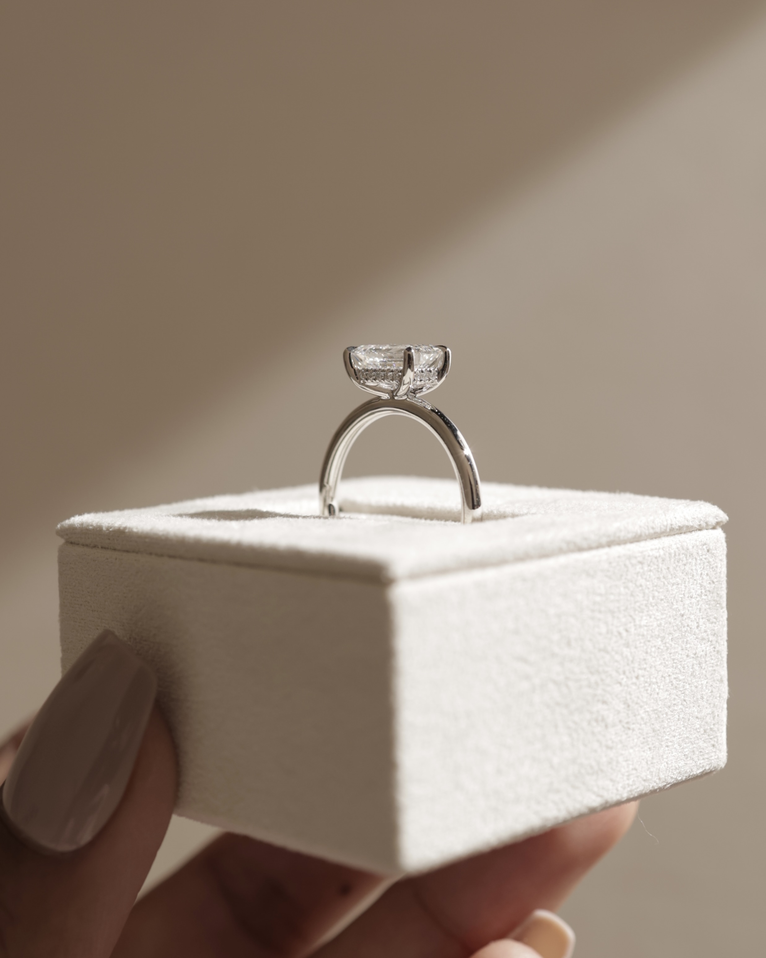 Zayla - 4 Claw East West Emerald with Hidden Halo Lifestyle Image