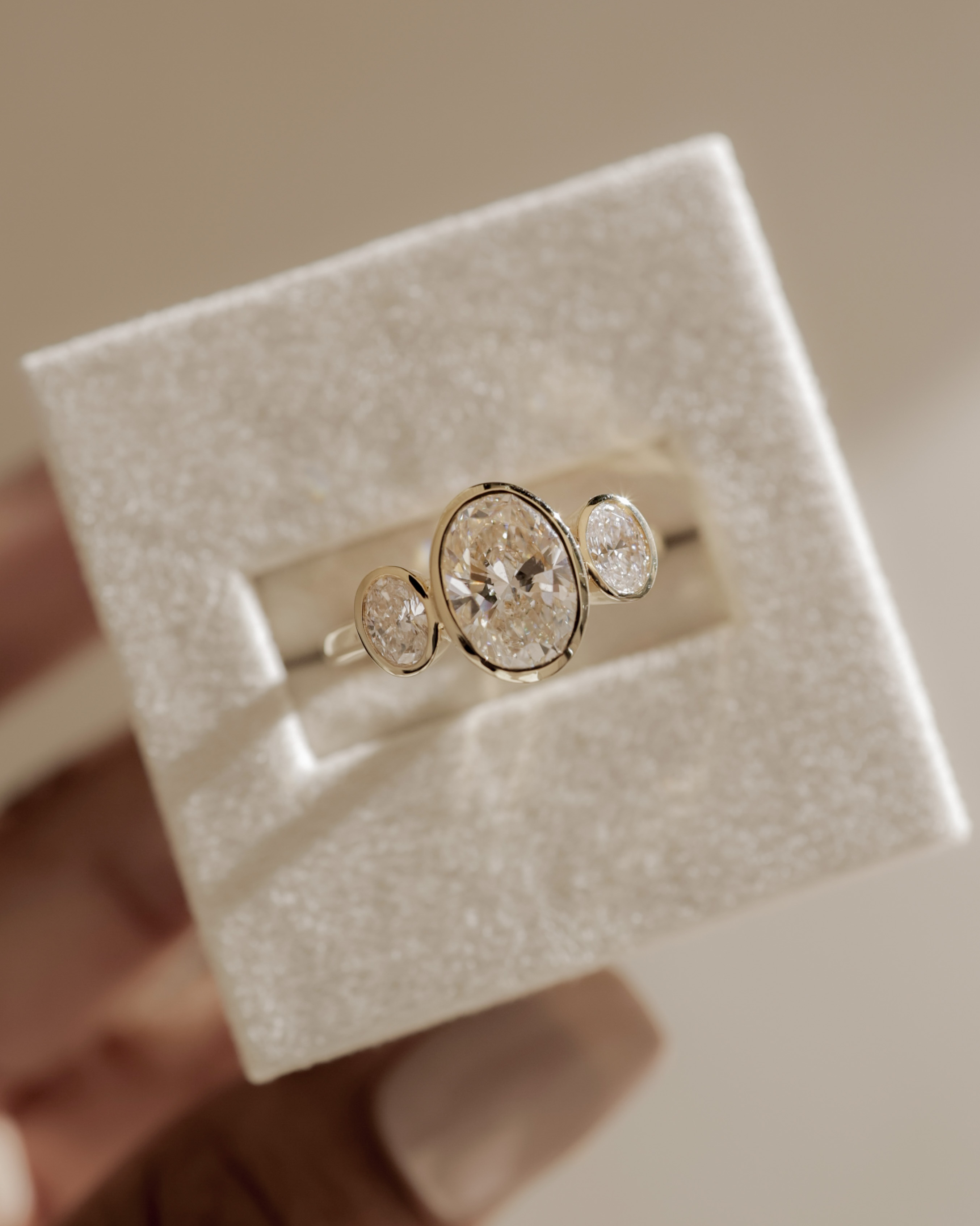 Zelda - Bezel Set Oval Trilogy Lifestyle Image